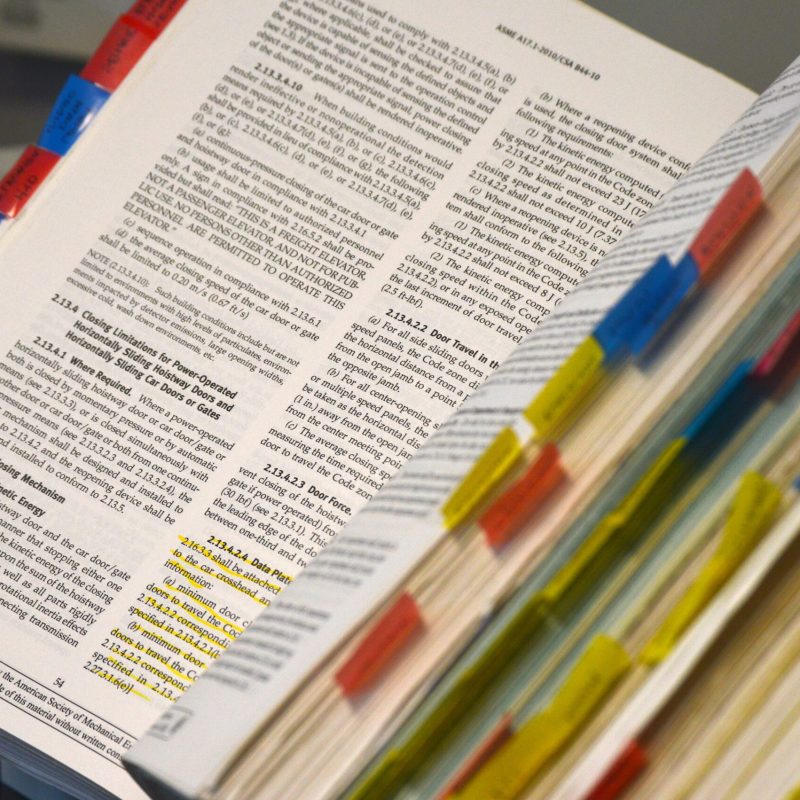 book of research with sticky notes